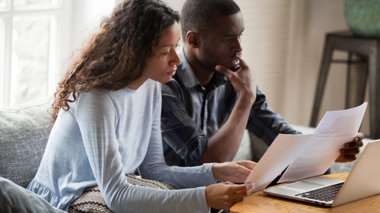 couple looking over financial papers